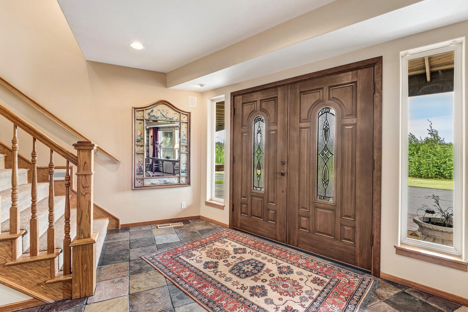 60470 Arnold Market Road Bend, OR 97702 - Photo 26 of 53 The front porch leads to this foyer, with stairs up to the main floor living. The following family room photos are on this lower level.