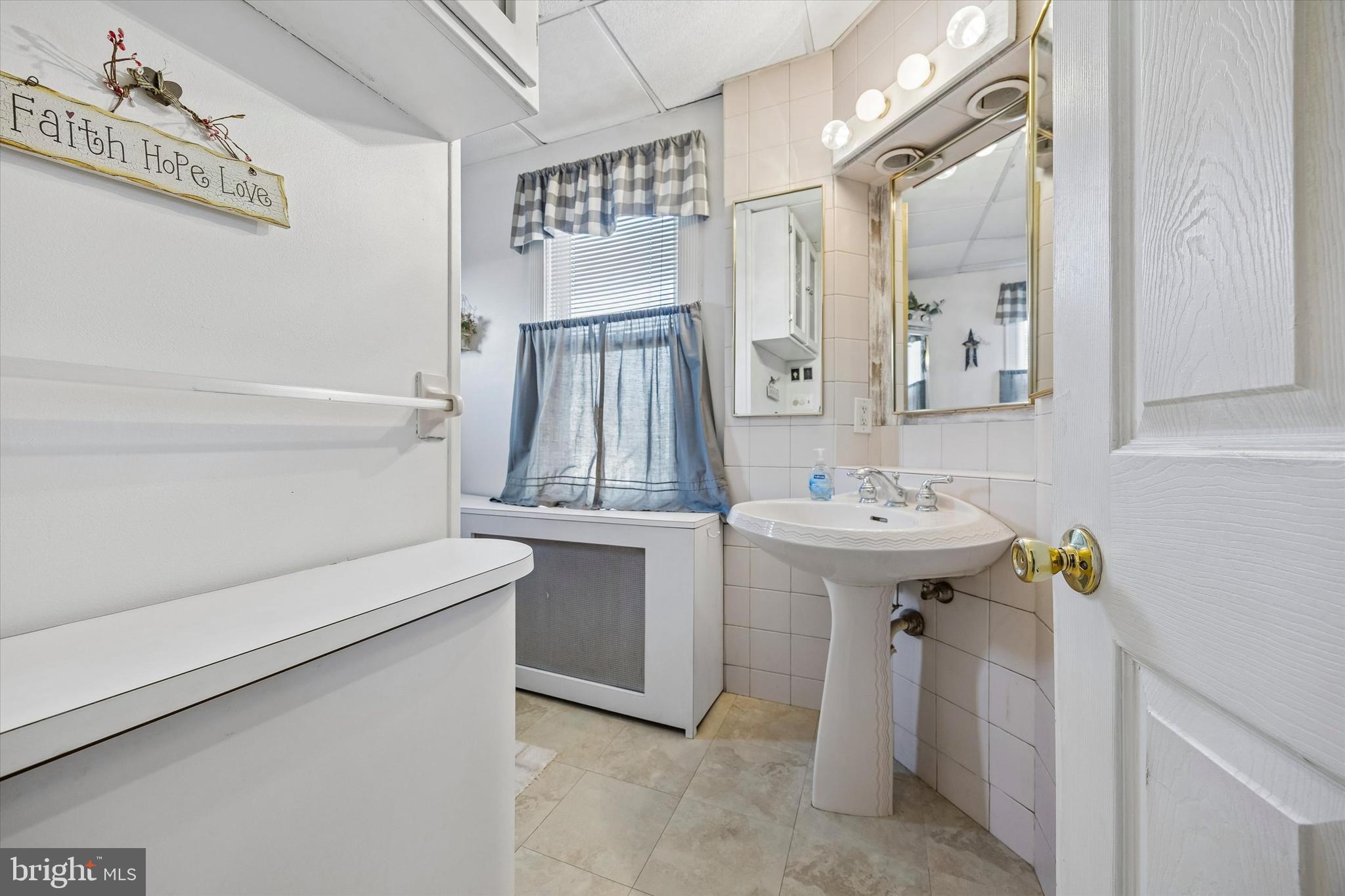 620 Gilbert Road Ridley Park, PA 19078 - Photo 21 of 35 a bathroom with a sink a toilet and shower