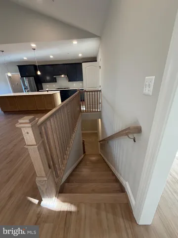 a view of a hallway with seating space