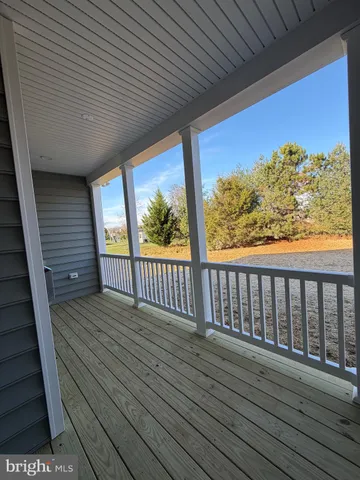 a view of balcony with wooden floor