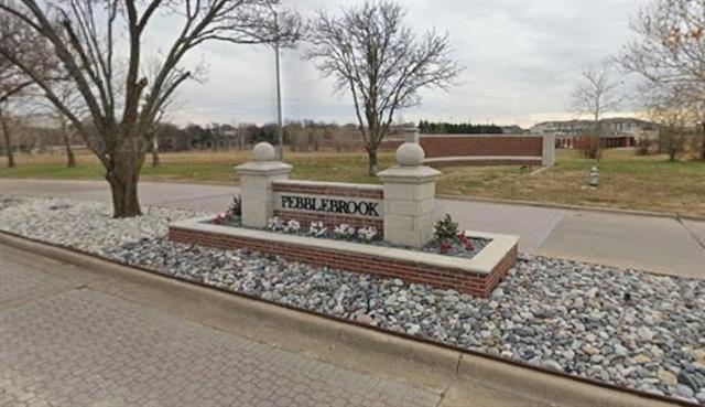 a sign on the side of a street