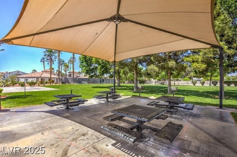 3318 North Decatur Boulevard, Unit 2138 Las Vegas, NV 89130 - Photo 38 of 40 View of home's community with a yard and a patio