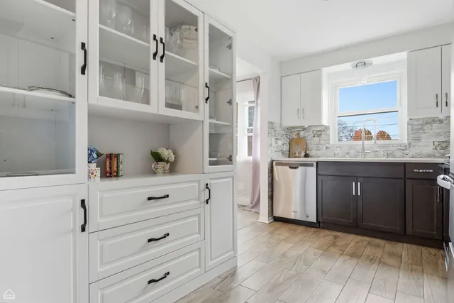 a bathroom with a sink toilet vanity and bathtub