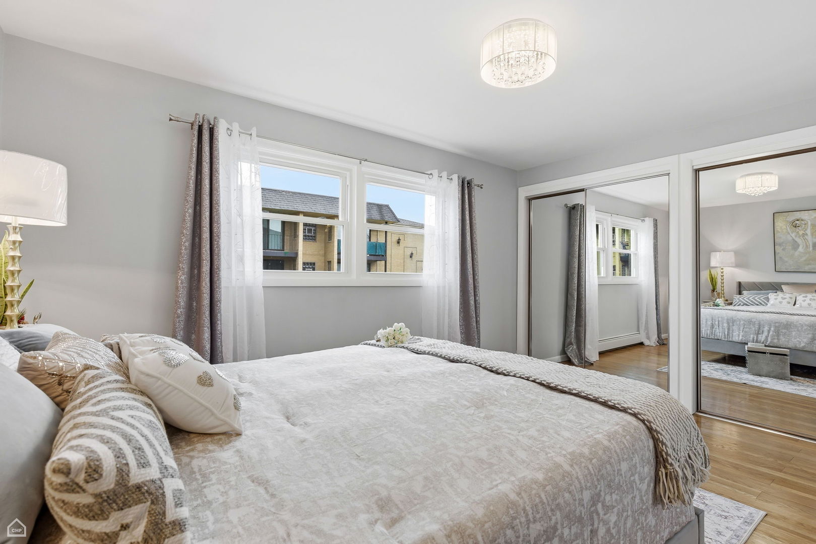 6568 West Roscoe Street, Unit 2N Chicago, IL 60634 - Photo 20 of 31 a bedroom with a bed and a window