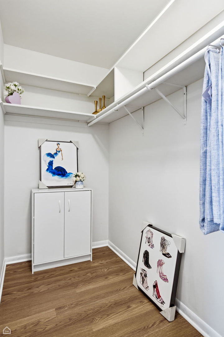 6568 West Roscoe Street, Unit 2N Chicago, IL 60634 - Photo 21 of 31 a view of a livingroom with wooden floor