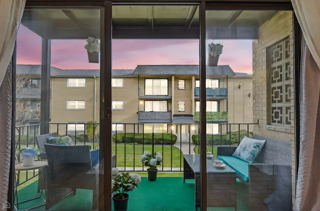 a balcony view with a garden space