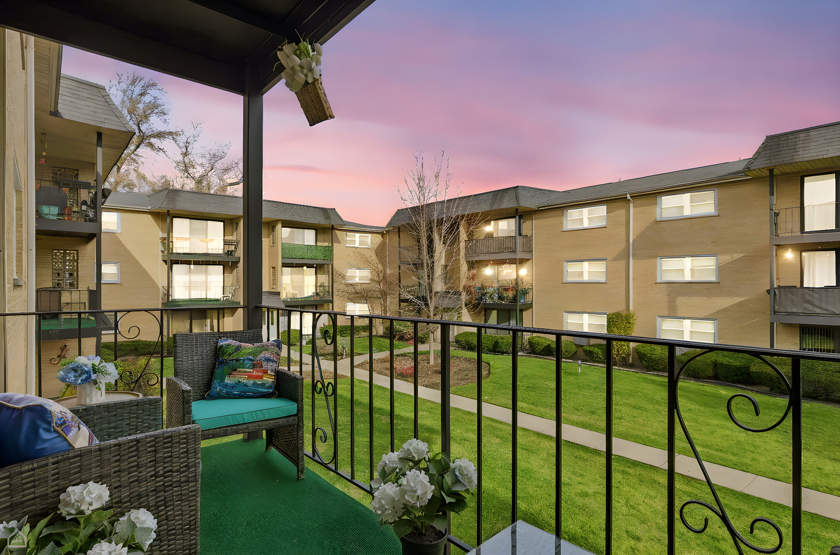 6568 West Roscoe Street, Unit 2N Chicago, IL 60634 - Photo 25 of 31 a front view of a house with a garden