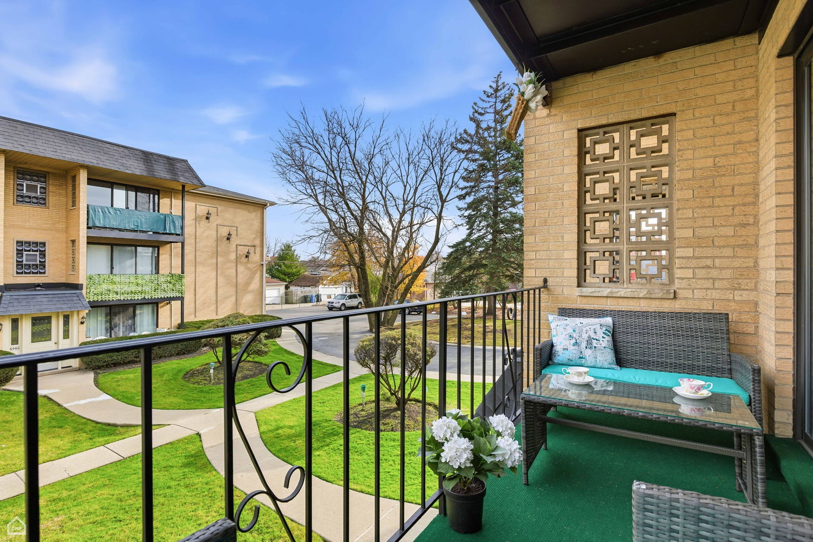 6568 West Roscoe Street, Unit 2N Chicago, IL 60634 - Photo 26 of 31 a balcony view with a garden space