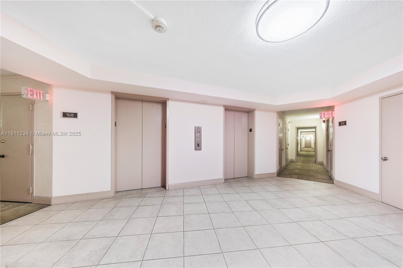 1300 Northeast Miami Gardens Drive, Unit 512E Miami, FL 33179 - Photo 20 of 22 an empty room with closet and windows