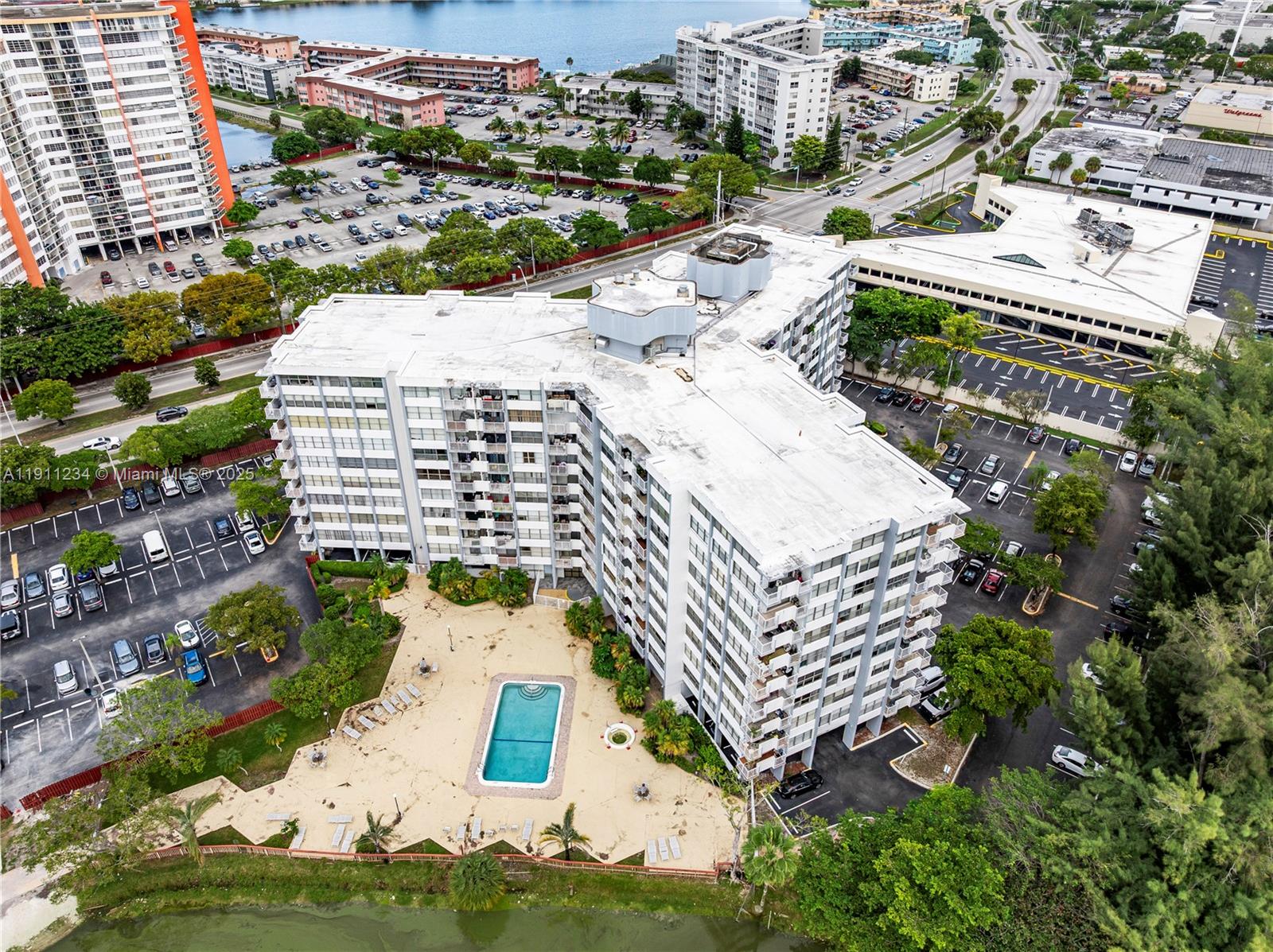 1300 Northeast Miami Gardens Drive, Unit 512E Miami, FL 33179 - Photo 2 of 22 an aerial view of residential houses with yard