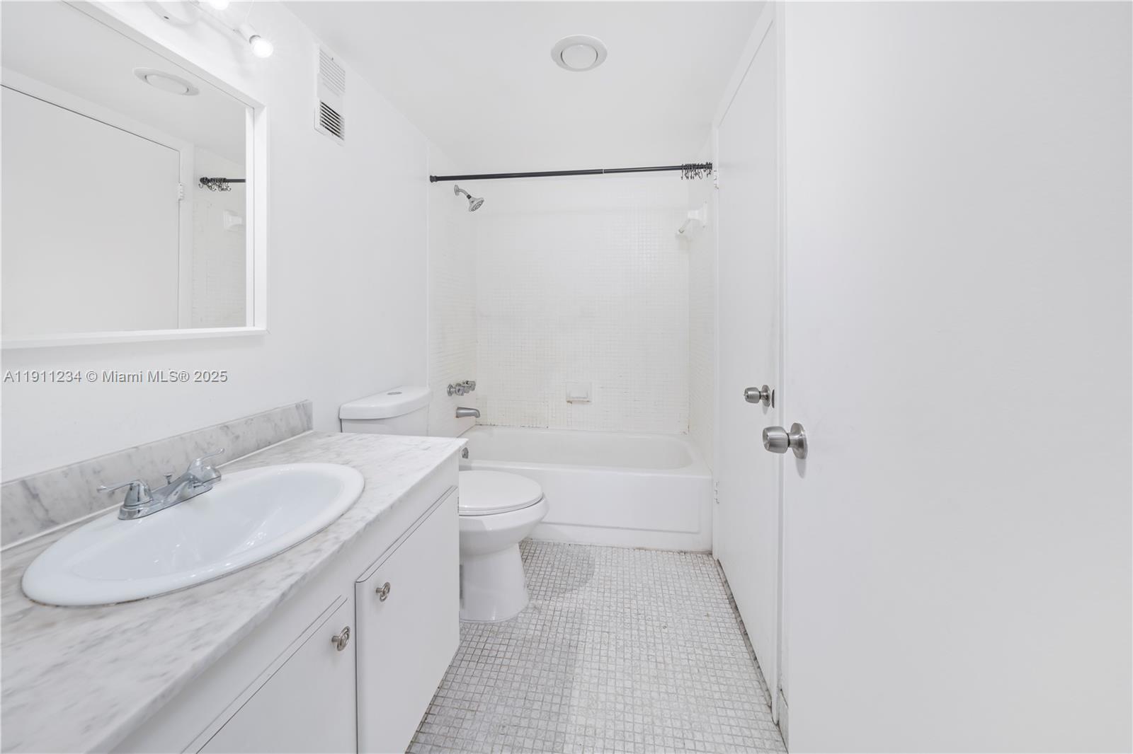 1300 Northeast Miami Gardens Drive, Unit 512E Miami, FL 33179 - Photo 10 of 22 a bathroom with a sink toilet and shower