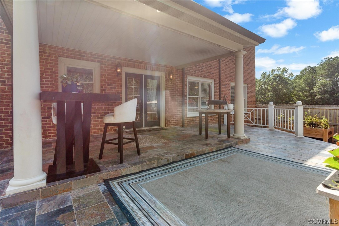 19960 Horseshoe Road Carson, VA 23830 - Photo 35 of 47 a view of a patio with table and chairs with wooden floor and fence