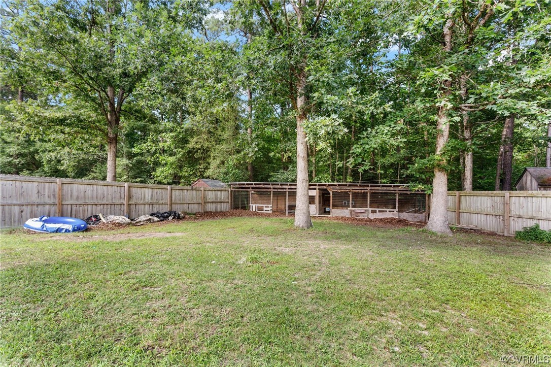 19960 Horseshoe Road Carson, VA 23830 - Photo 36 of 47 a view of a deck with a bench and trees