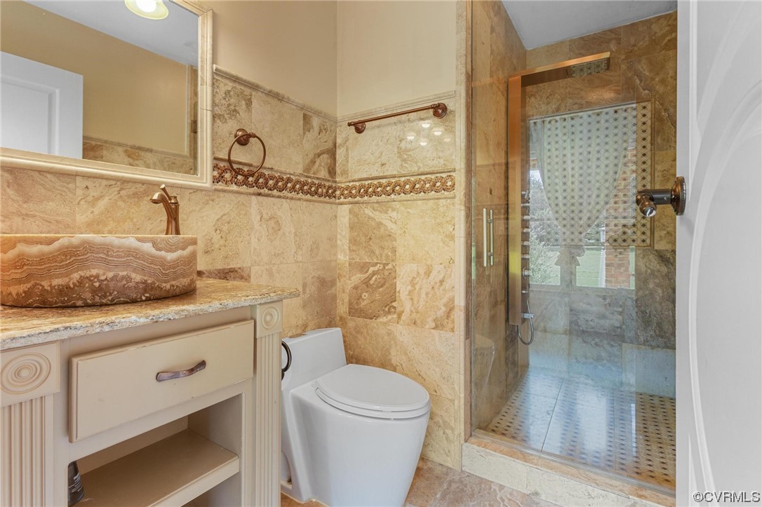19960 Horseshoe Road Carson, VA 23830 - Photo 8 of 47 a bathroom with a granite countertop sink a toilet and shower