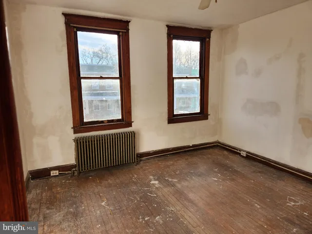 an empty room with windows