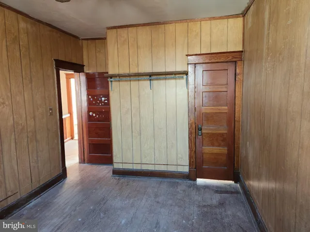 an empty room with wooden door