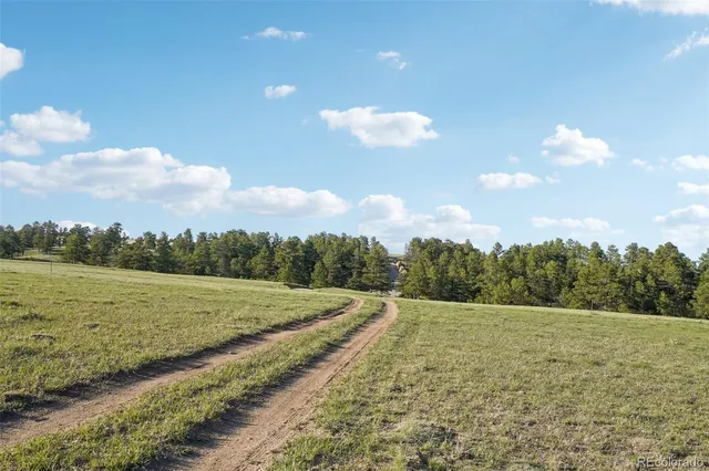 a view of a lake with a big yard