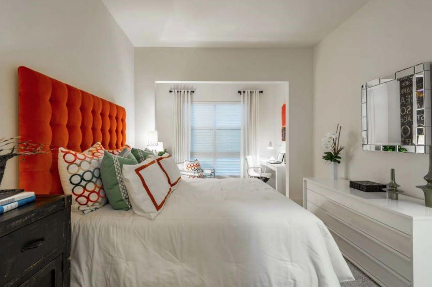 1391 Collier Road Northwest, Unit 2105 Atlanta, GA 30318 - Photo 12 of 43 a bedroom with a bed and a window