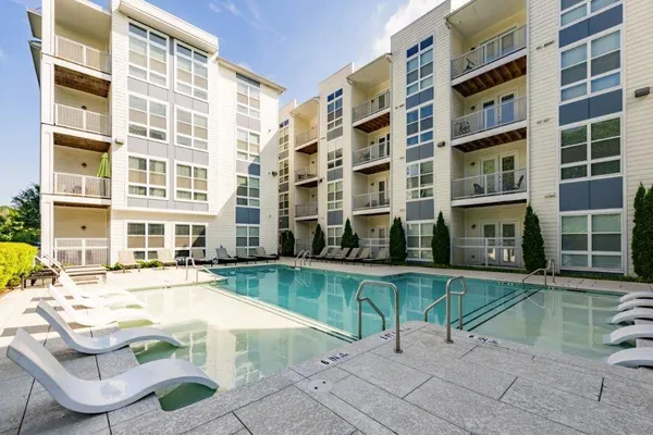 a view of a swimming pool with a lounge chair