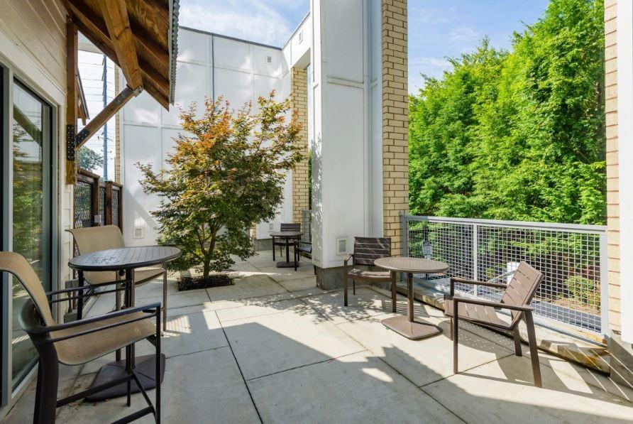 1391 Collier Road Northwest, Unit 2105 Atlanta, GA 30318 - Photo 21 of 43 a view of chair and tables