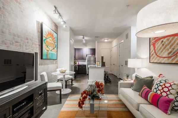 a living room with furniture and a flat screen tv