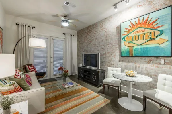 a living room with furniture and a flat screen tv