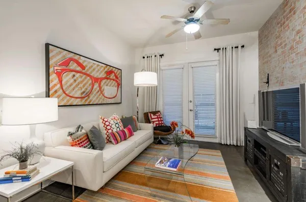 a living room with furniture and a flat screen tv