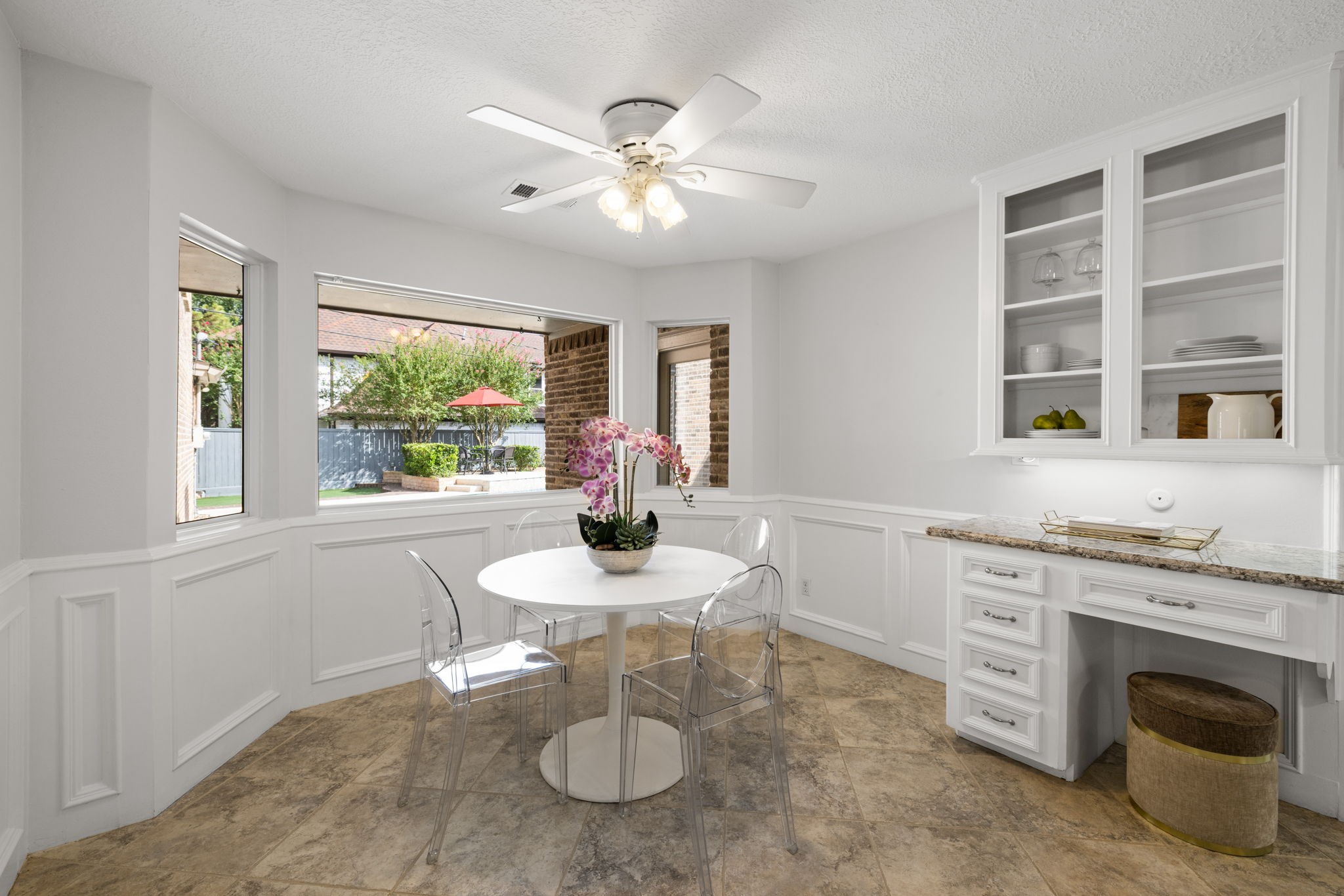 9203 Godstone Lane Spring, TX 77379 - Photo 18 of 49 This Chef’s Desk in the Breakfast Area offers built-in storage and open shelving. This is the perfect place to set-up a charging station or to sit and pay monthly bills. The bay window offers beautiful views of the yard and pool.