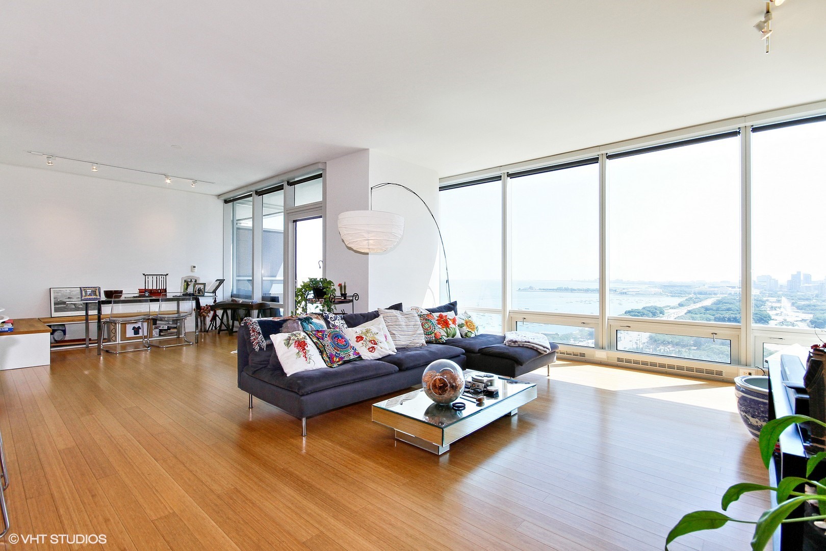 340 East Randolph Street, Unit 1803 Chicago, IL 60601 - Photo 3 of 19 a living room with furniture and a large window