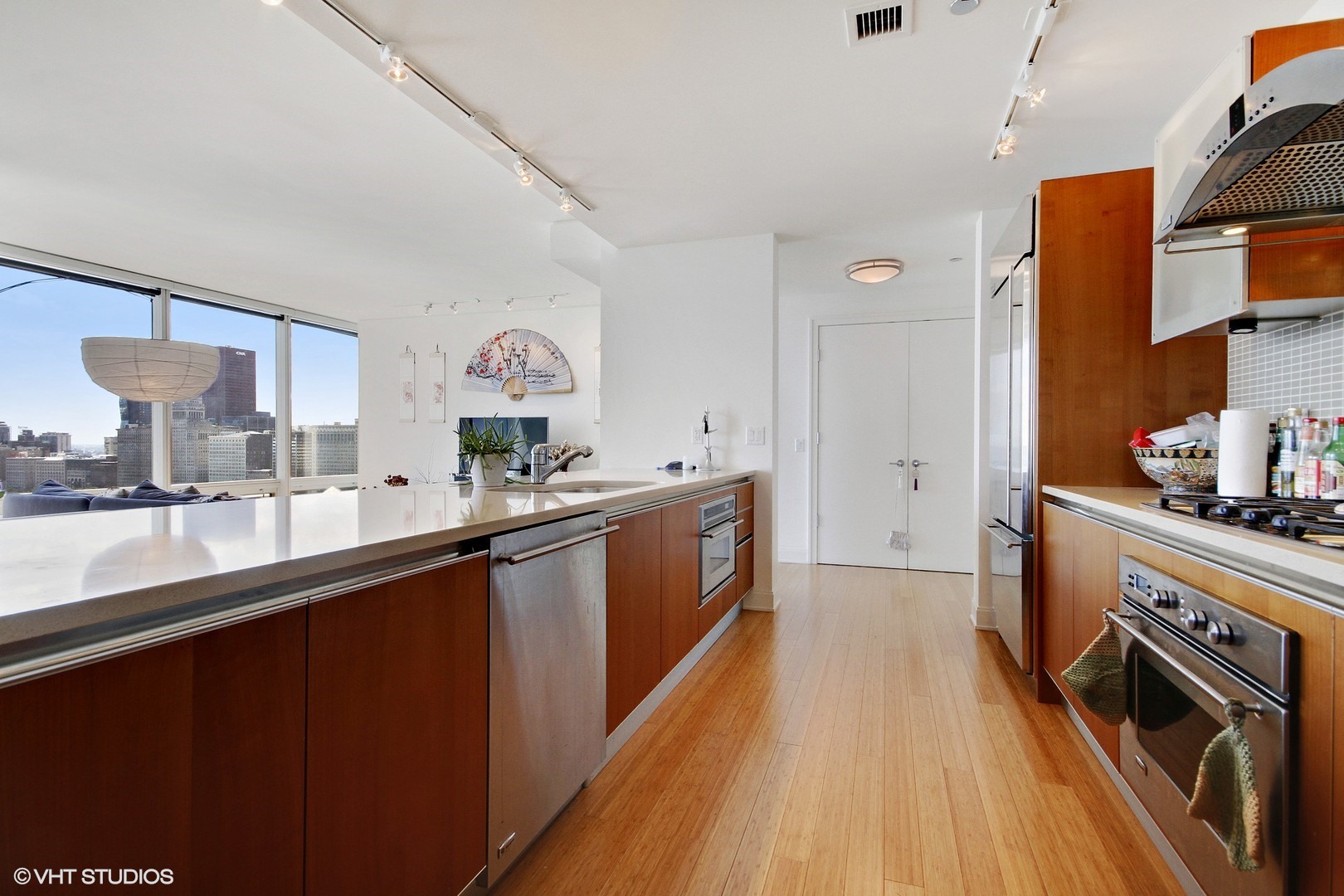340 East Randolph Street, Unit 1803 Chicago, IL 60601 - Photo 4 of 19 a kitchen with stainless steel appliances a sink dishwasher stove and refrigerator