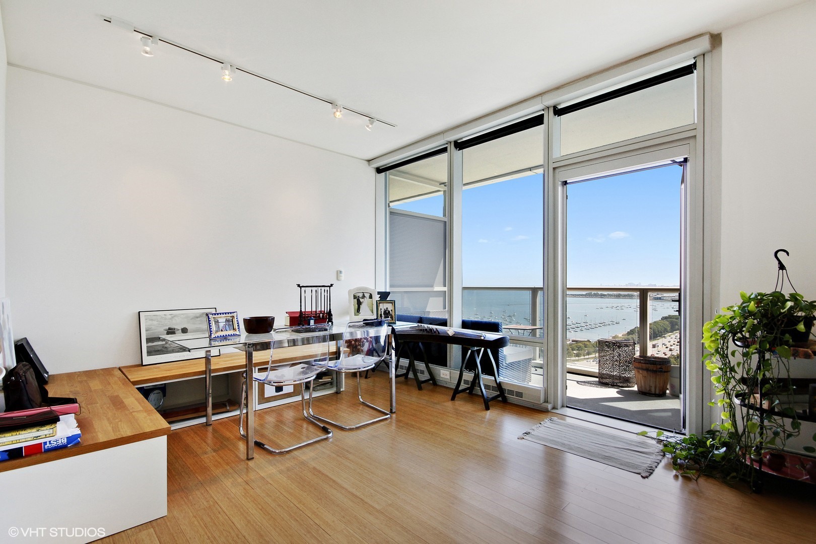340 East Randolph Street, Unit 1803 Chicago, IL 60601 - Photo 7 of 19 a view of a workspace with furniture and a livingroom