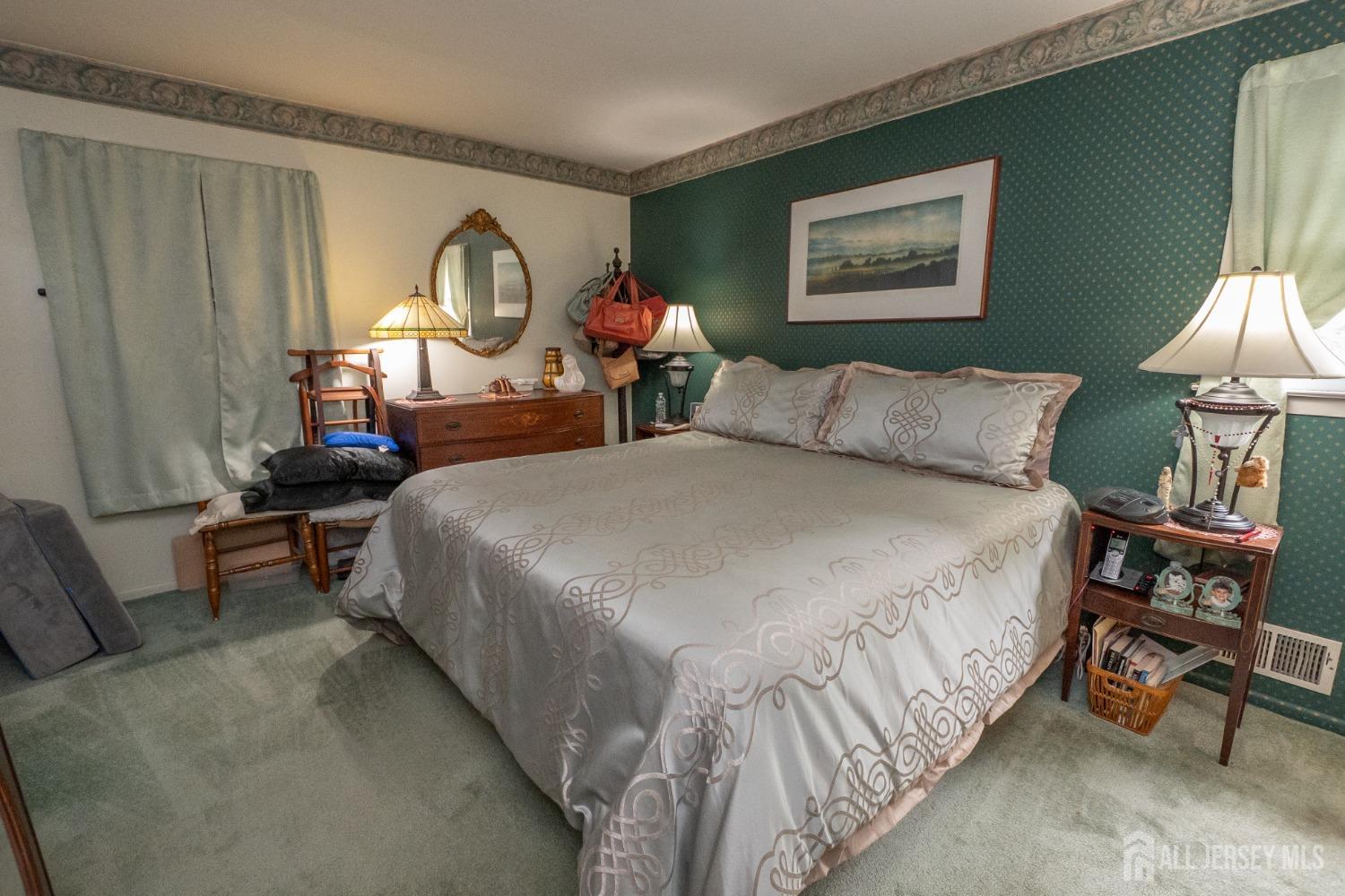 73 Wellington Road East Brunswick, NJ 08816 - Photo 12 of 39 a bed room with a bed and a lamp