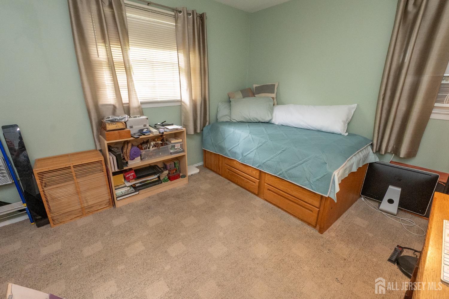 73 Wellington Road East Brunswick, NJ 08816 - Photo 15 of 39 a bed room with a bed and a window