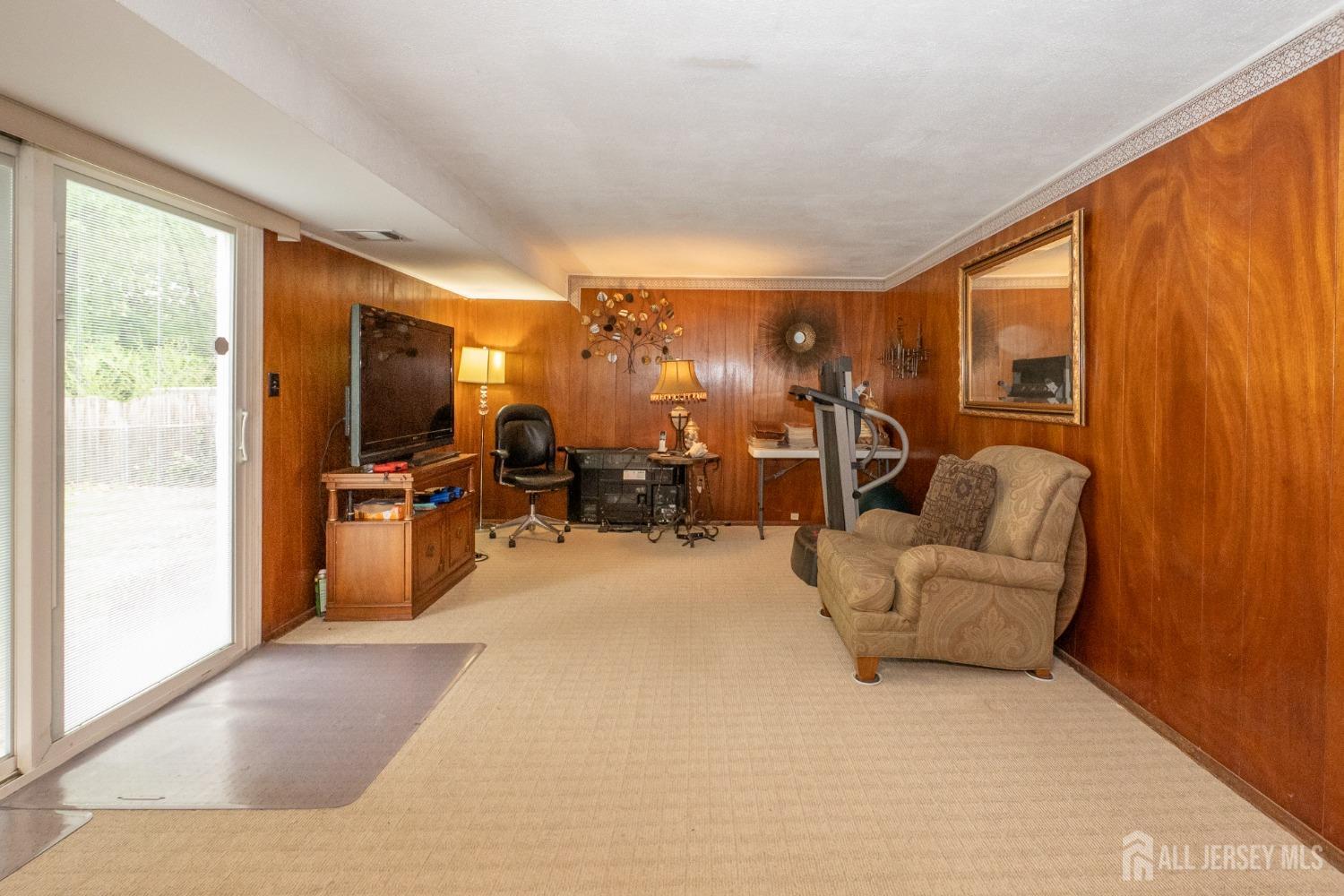 73 Wellington Road East Brunswick, NJ 08816 - Photo 20 of 39 a view of a livingroom with furniture and windows