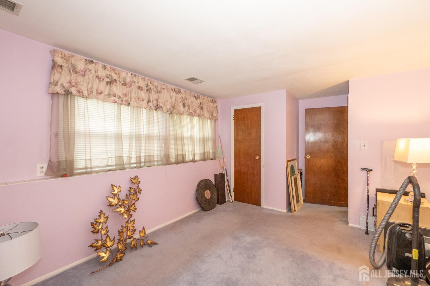 73 Wellington Road East Brunswick, NJ 08816 - Photo 21 of 39 a view of a room with gym equipment