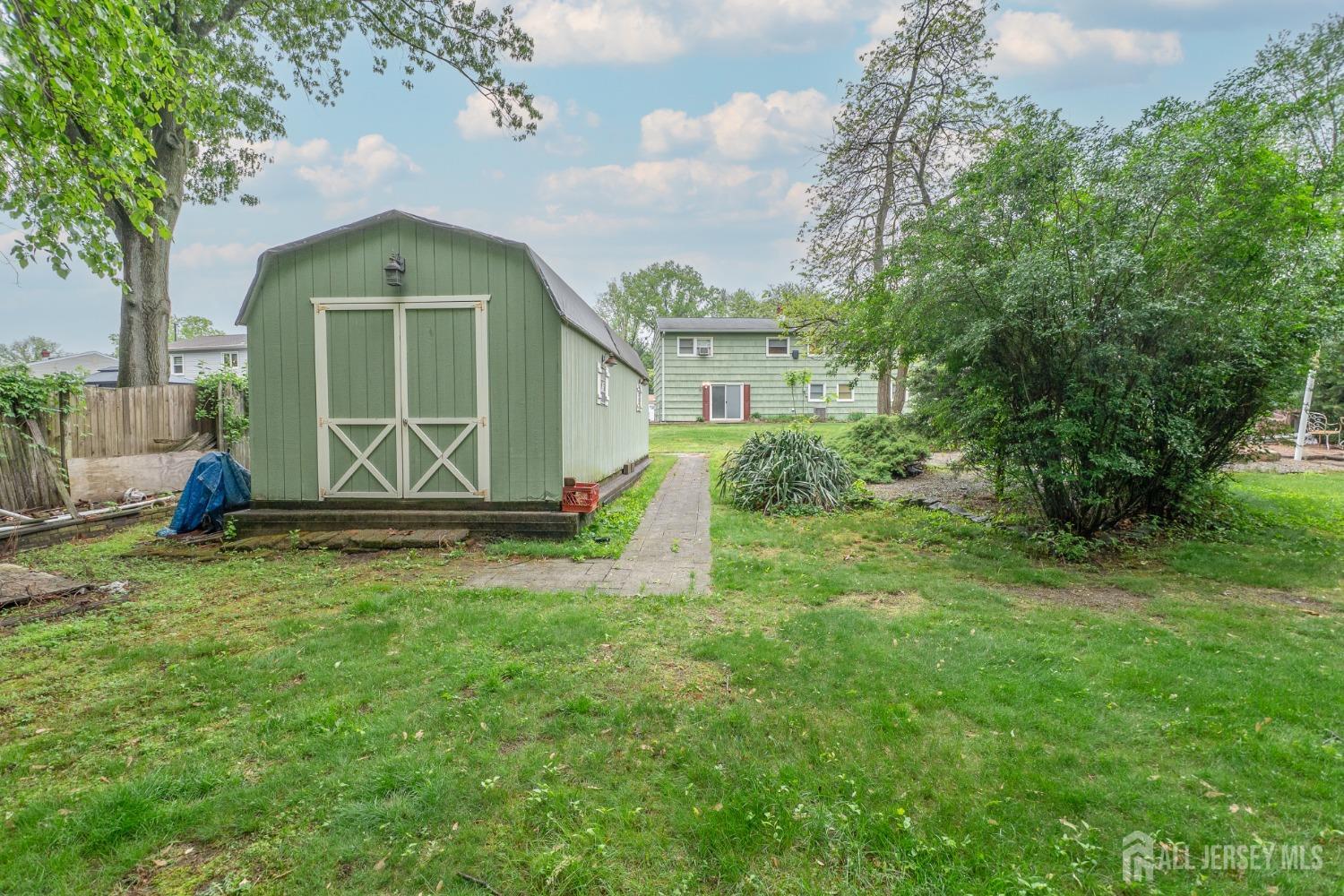 73 Wellington Road East Brunswick, NJ 08816 - Photo 30 of 39 a front view of a house with garden