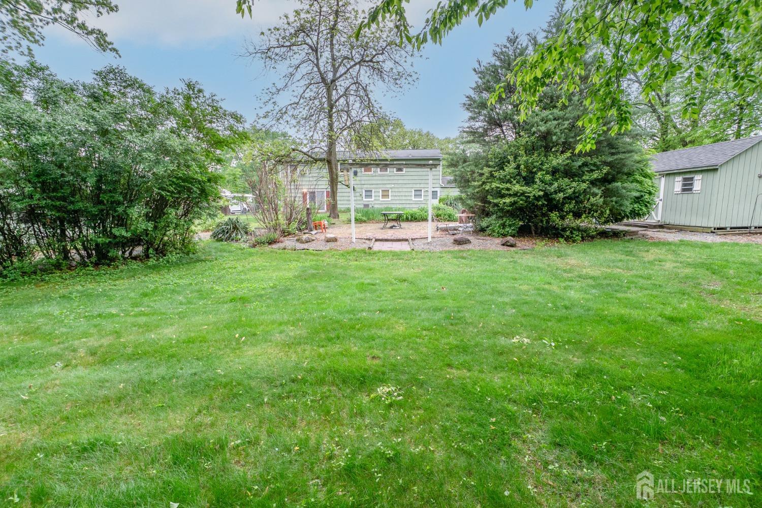 73 Wellington Road East Brunswick, NJ 08816 - Photo 31 of 39 a front view of a house with garden