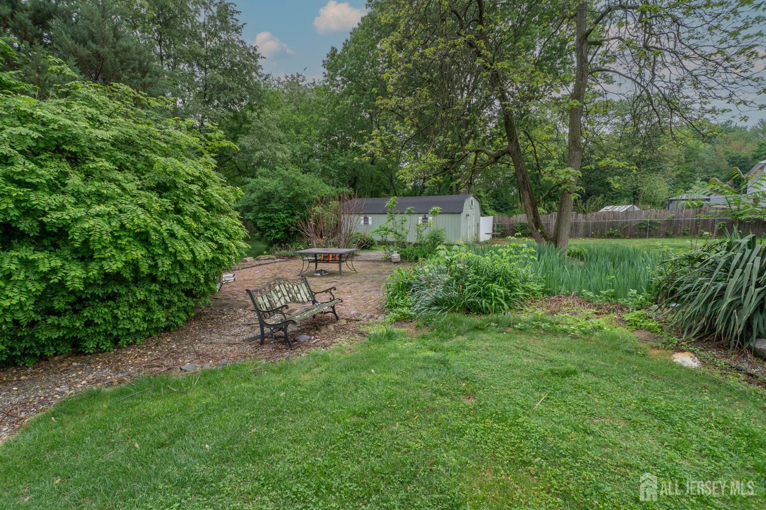 73 Wellington Road East Brunswick, NJ 08816 - Photo 36 of 39 a view of a backyard with sitting area