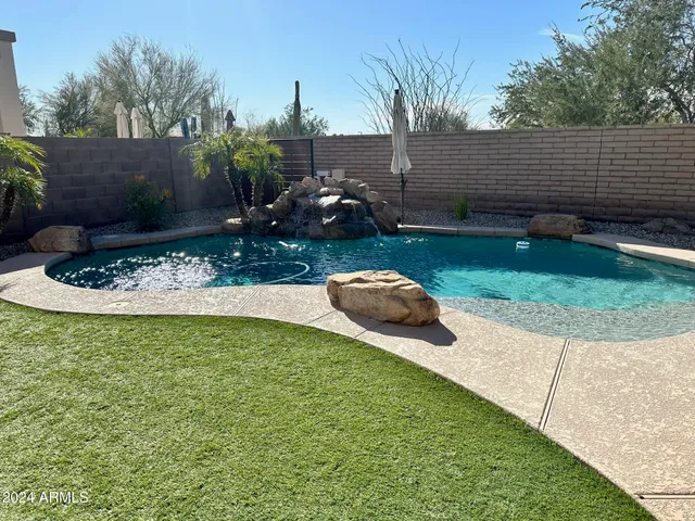 a view of a backyard with sitting area