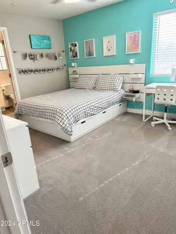 a bedroom with a bed and furniture