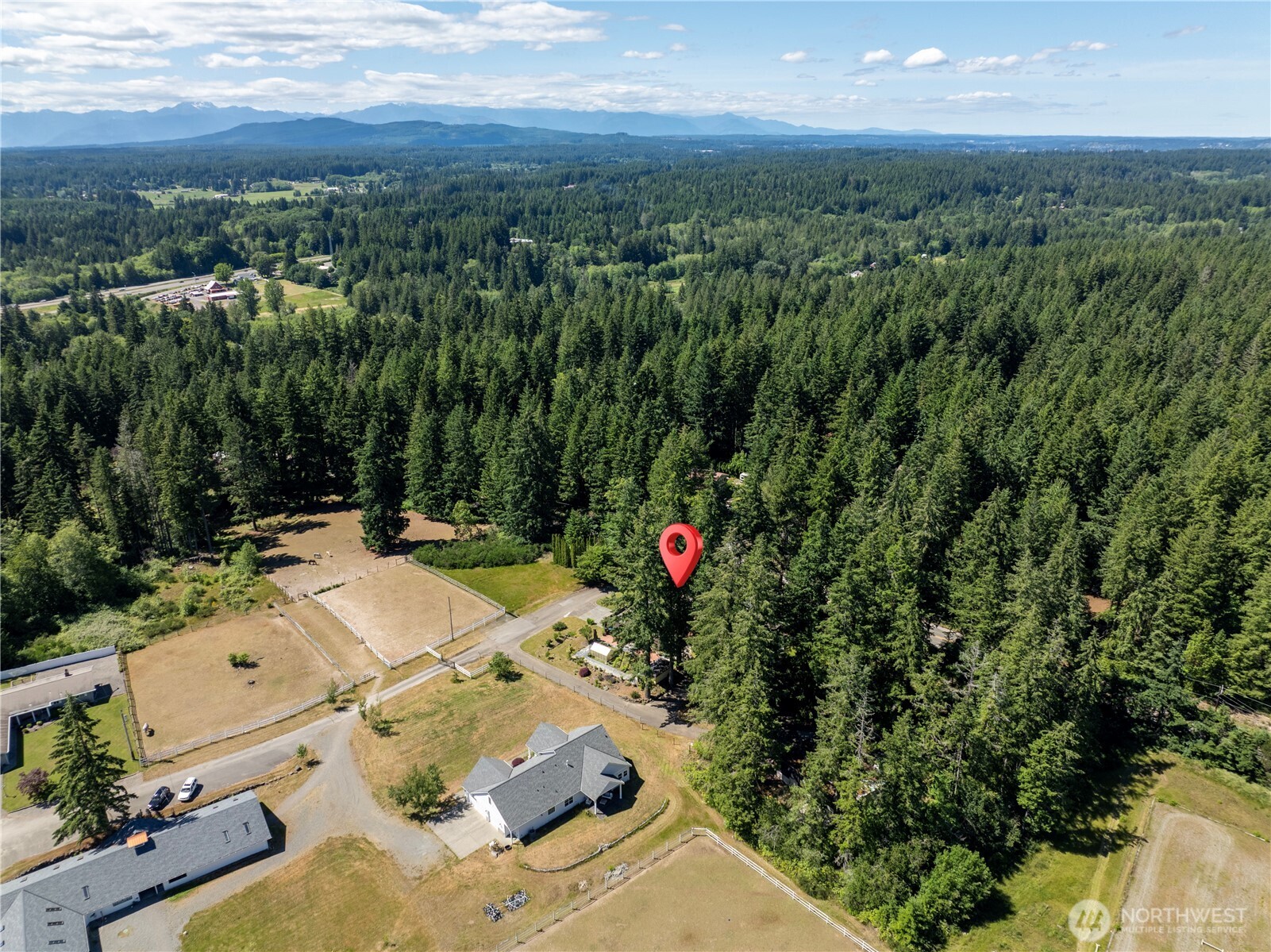 3050 Southeast Mullenix Road Port Orchard, WA 98367 - Photo 38 of 40 an aerial view of a house with a yard