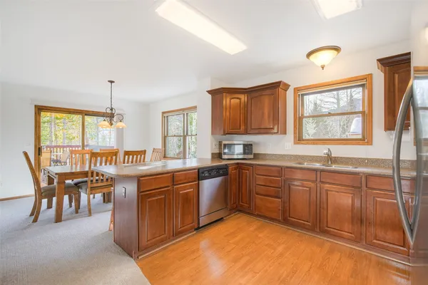 a kitchen with a sink and wooden cabinets