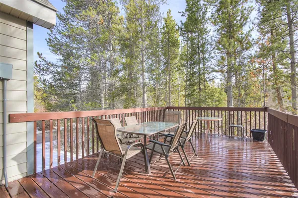 a view of a deck with furniture and wooden floor