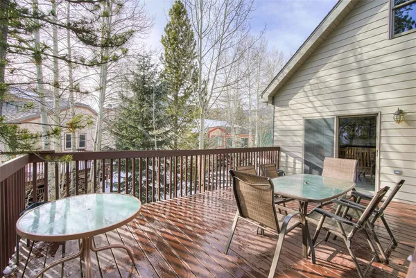 a view of a chairs and table in the balcony