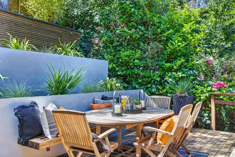 a view of outdoor sitting area with furniture and wooden deck