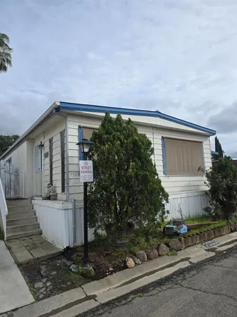 front view of a house with a street