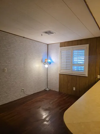 a view of a livingroom with wooden floor