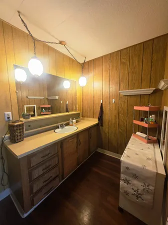a bathroom with a sink and mirror