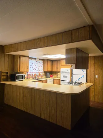 a kitchen with stainless steel appliances a sink and cabinets