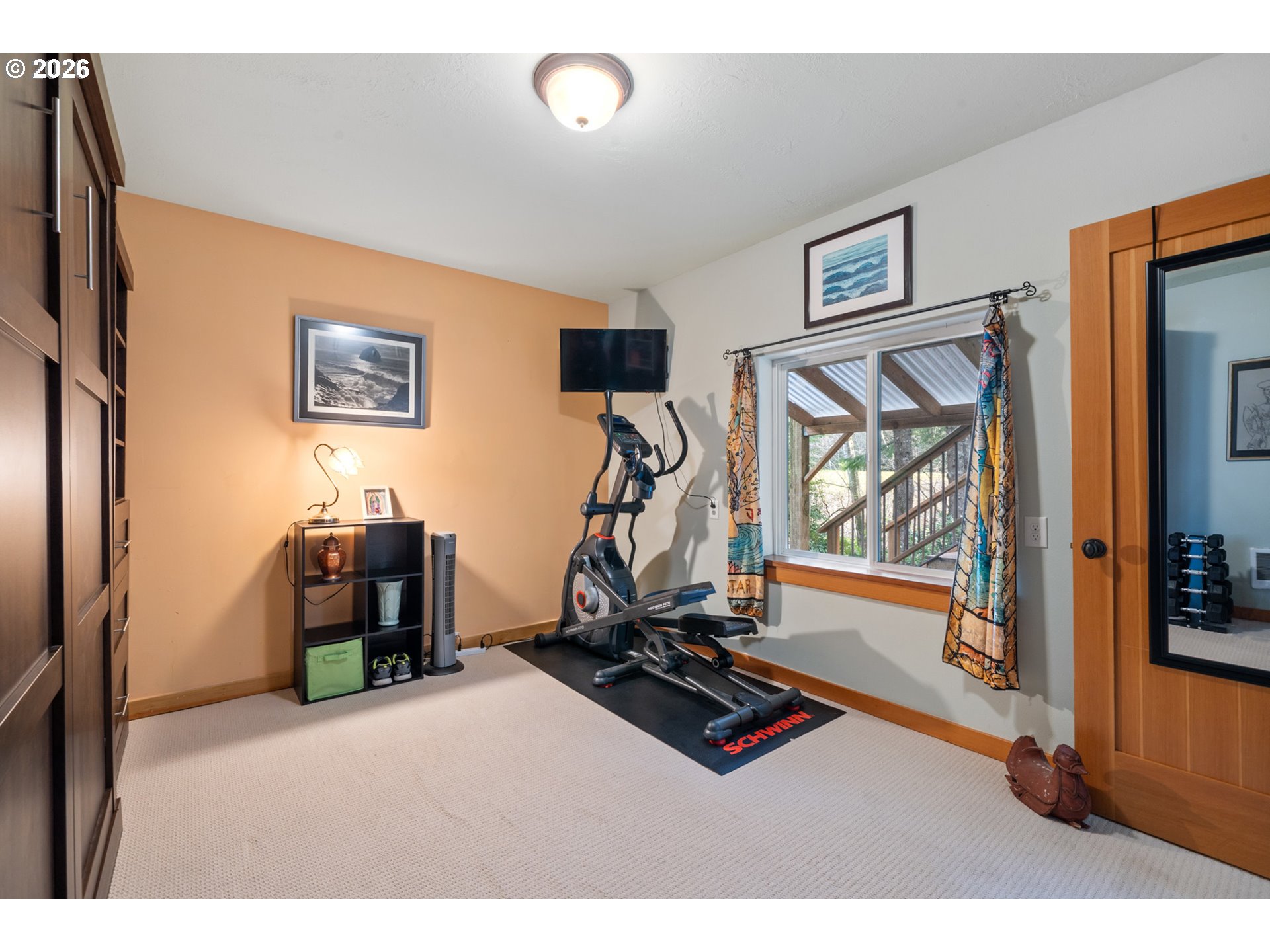 1055 Phelps Street Tillamook, OR 97141 - Photo 13 of 40 a room with gym equipment and windows